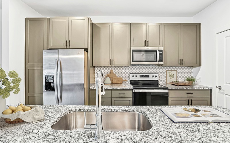 Kitchen with stainless steel appliances and granite counters
